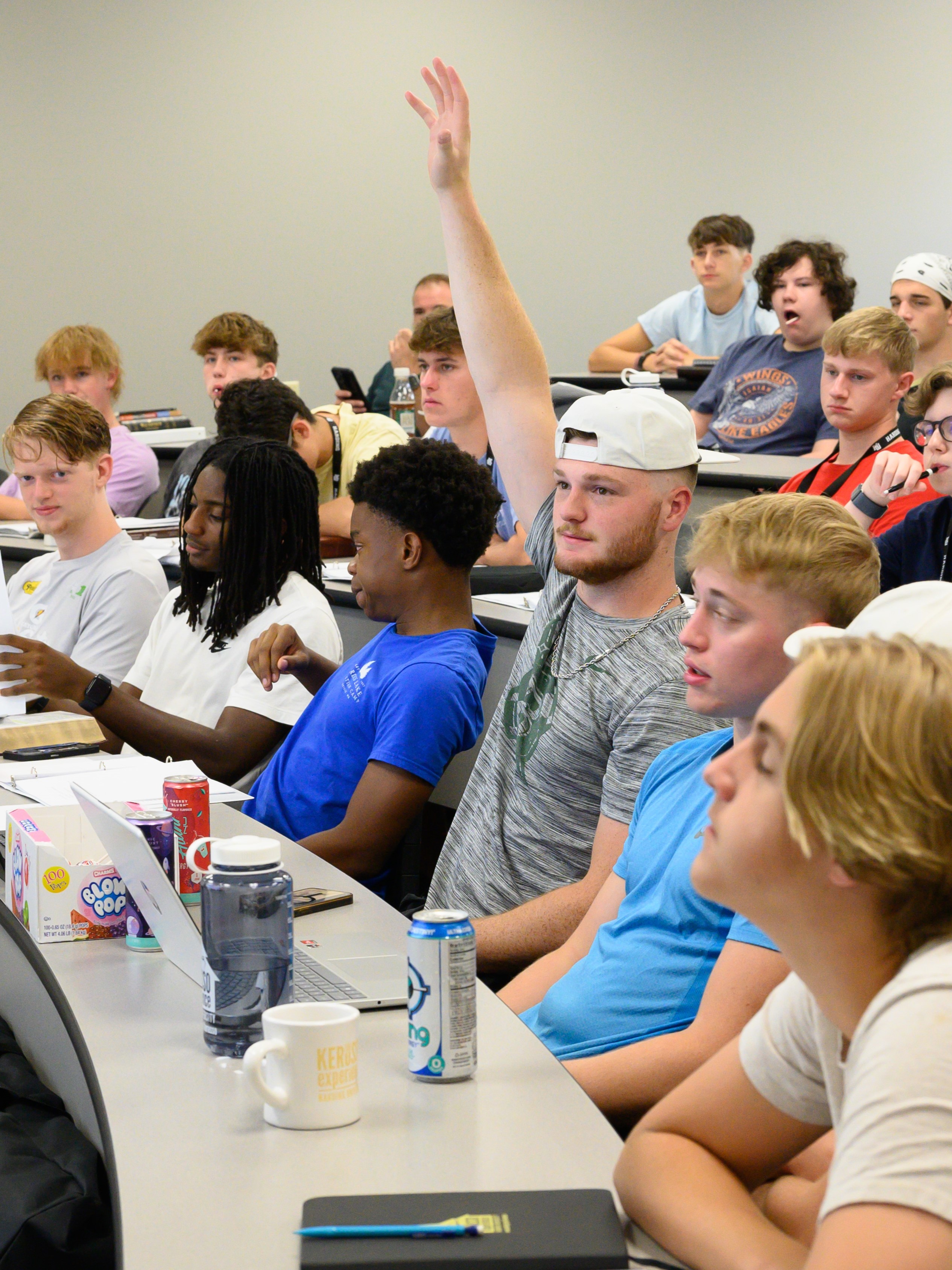 Guy in class raising his hand